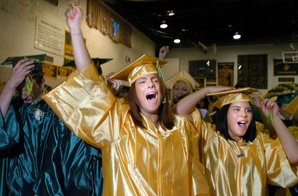 Graduates Lucia Johnson, of Ansonia, and Katelyn Rizzio, of Derby, celebrate after turning their tassels Wednesday June 16, 2010 during the Emmett O'Brien Technical High School commencement ceremony.