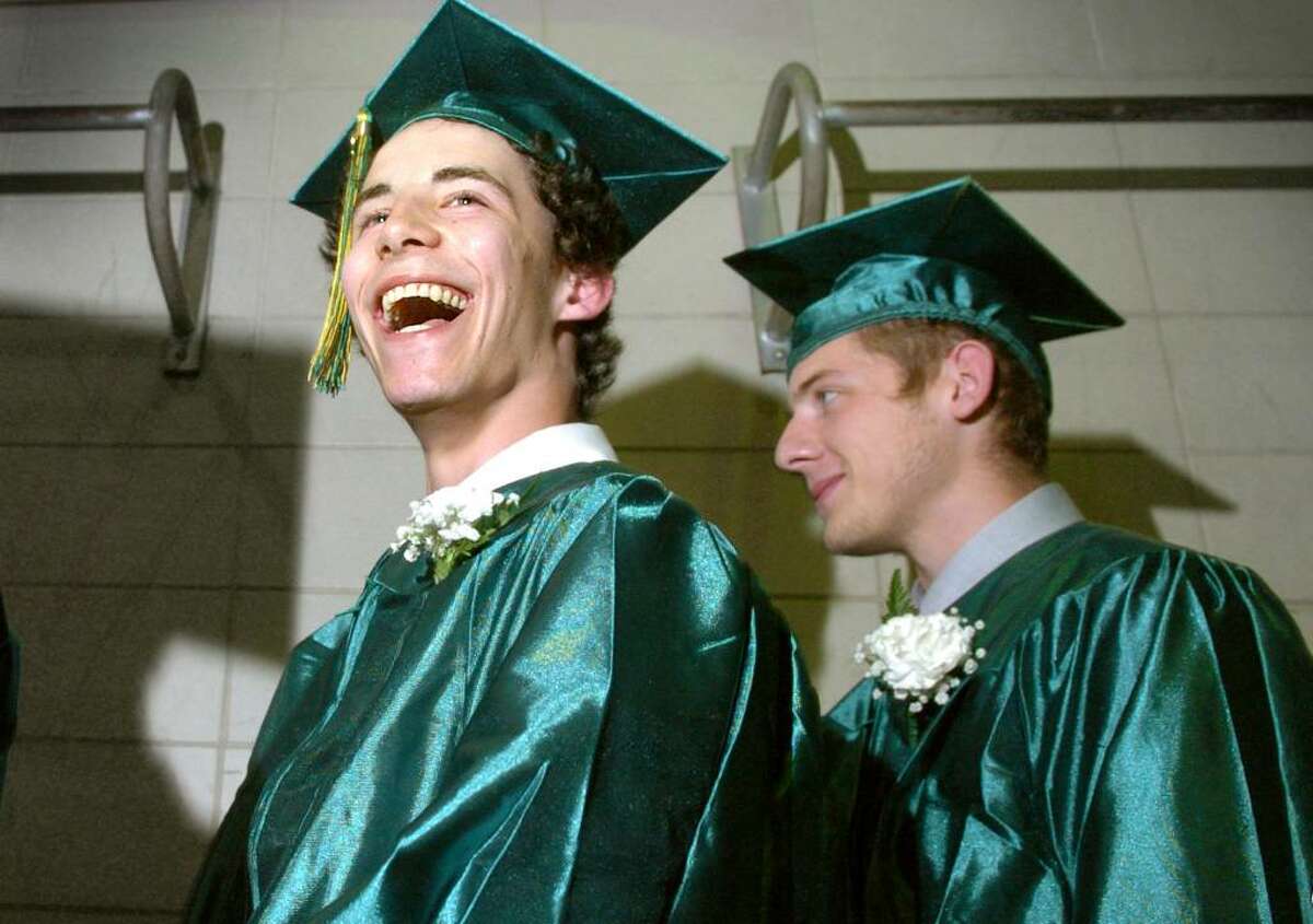 Graduate Thomas Laufer gives the crowd a big smile as he waits in line along with classmate Thomas Moscato Jr. to receive his diploma Wednesday June 16, 2010 during the Emmett O'Brien Technical High School commencement ceremony.