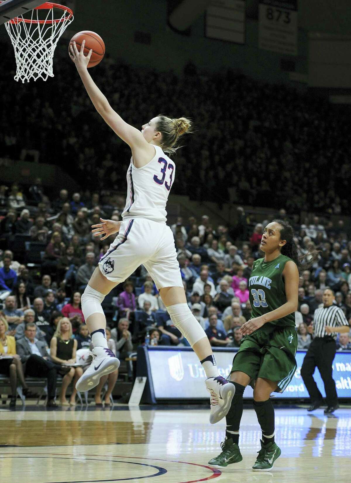 UConn’s Katie Lou Samuelson, left, goes up for a layup after a breakaway steal against Tulane on Sunday.