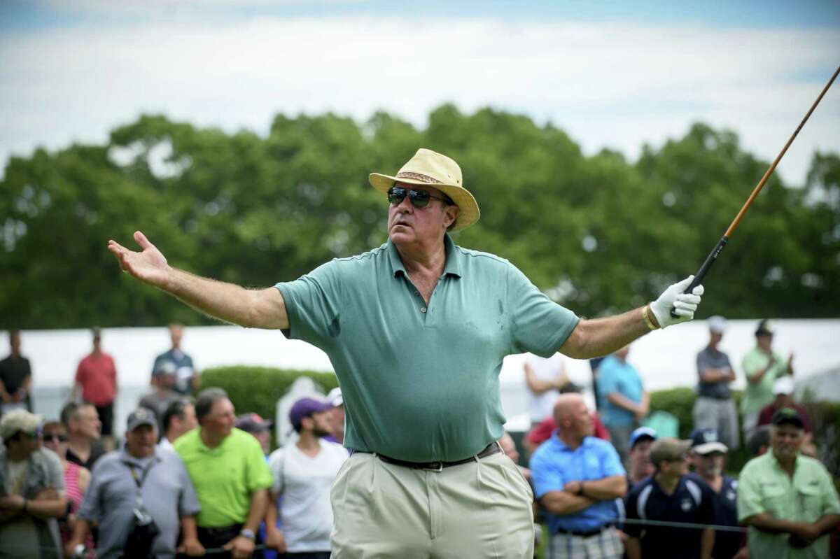 ESPN broadcaster Chris Berman turns to the crowd after teeing off on the first hole at the Travelers Championship at TPC River Highlands Wednesday in Cromwell.