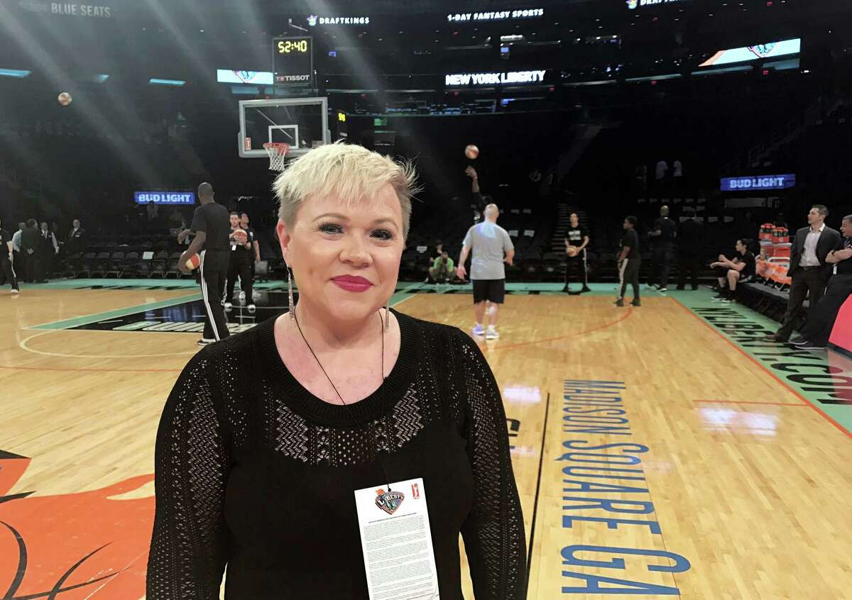 Holly Rowe stands on the court at Madison Square Garden in New York.