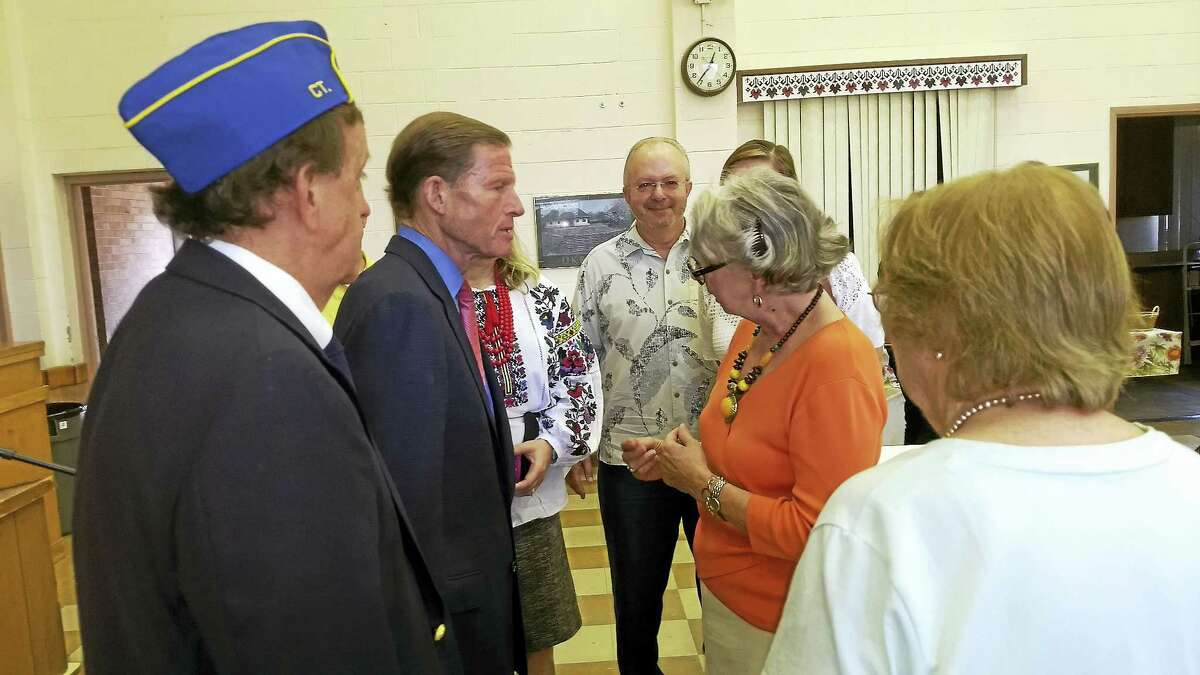 U.S. Sen. Richard Blumenthal chats with Anya Rohmer-Hanson following his talk after church at St. Michael’s Sunday regarding initiatives to help Ukraine and it’s soldiers in their fight with Russia.