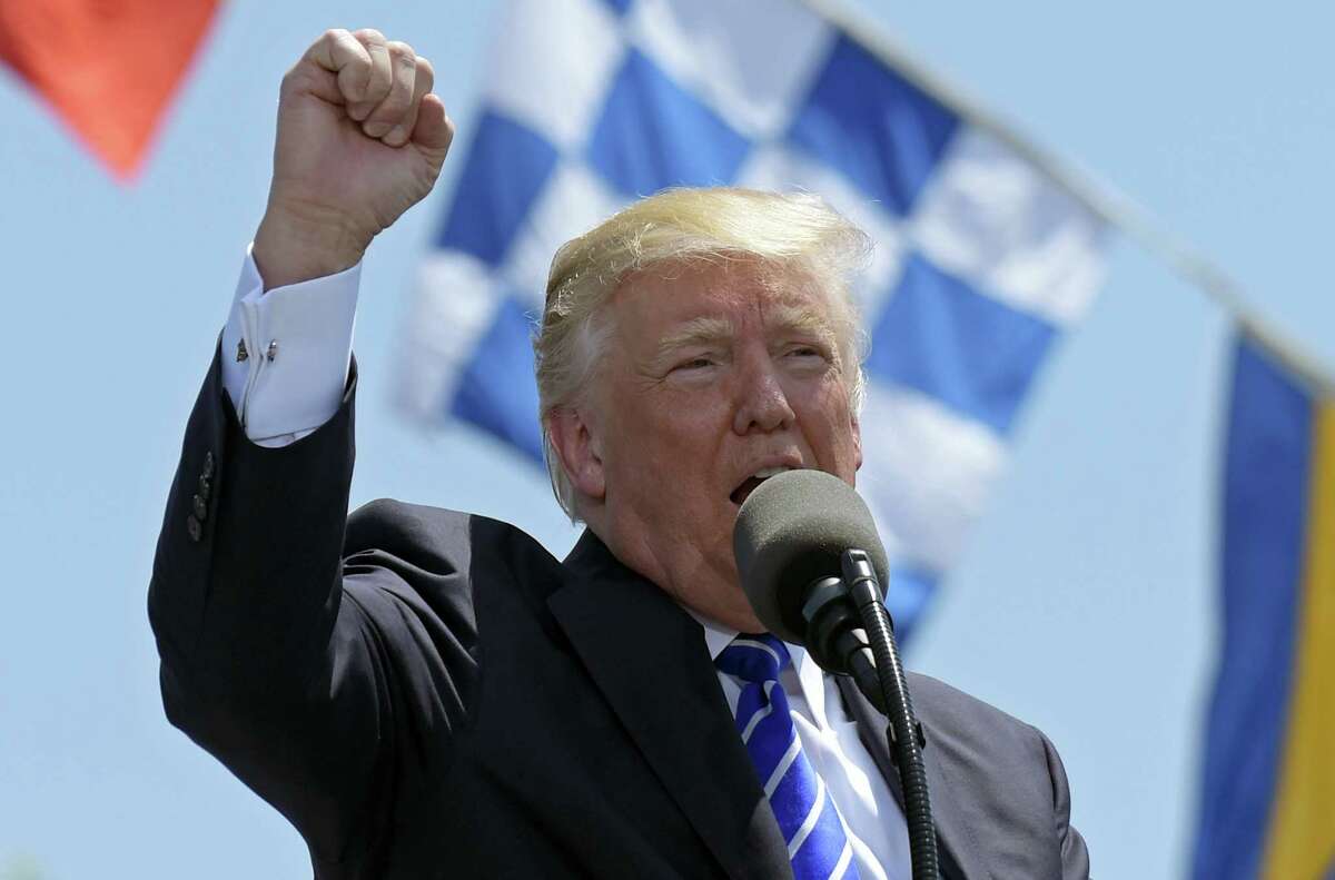 President Donald Trump gestures as he gives the commencement address at the U.S. Coast Guard Academy in New London, Conn., Wednesday, May 17, 2017.