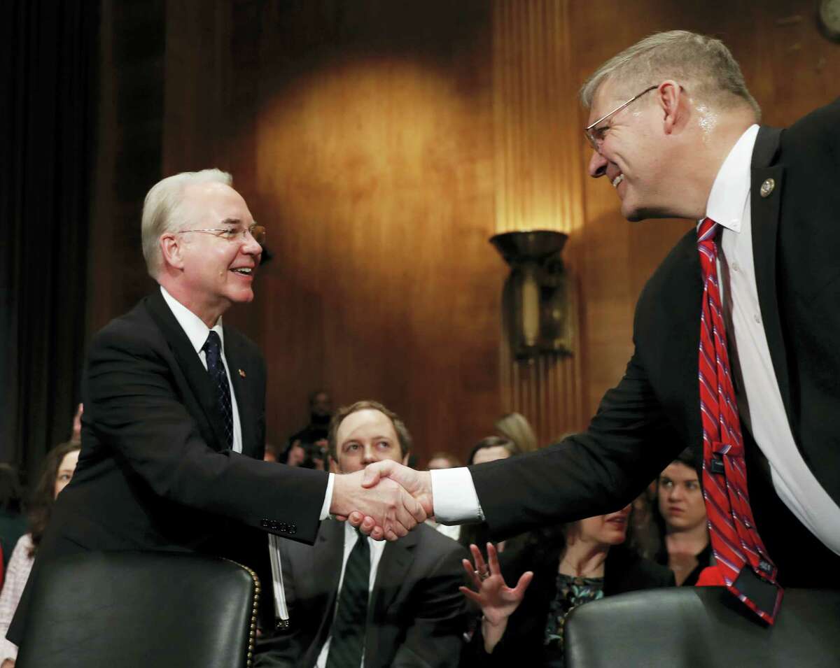 Health and Human Services Secretary-designate, Rep. Tom Price, R-Ga., left, is greeted on Capitol Hill in Washington, Wednesday, Jan. 18, 2017, by Rep. Barry Loudermilk, R-Ga., prior to testifying at this confirmation hearing before the Senate Health, Education, Labor and Pensions Committee.