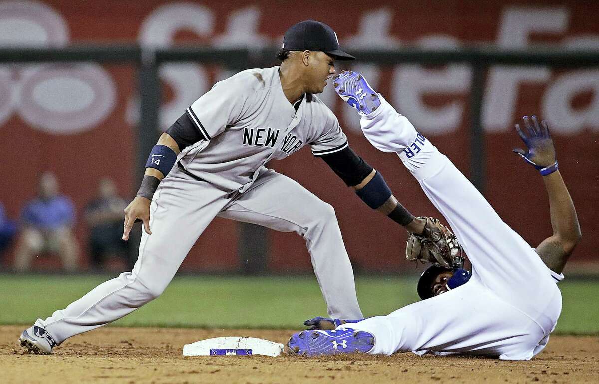 Kansas City Royals’ Jorge Soler is tagged out at second by New York Yankees second baseman Starlin Castro after trying to stretch a single into a double during the fifth inning of the Yankees’ win Tuesday at Kansas City, Mo.