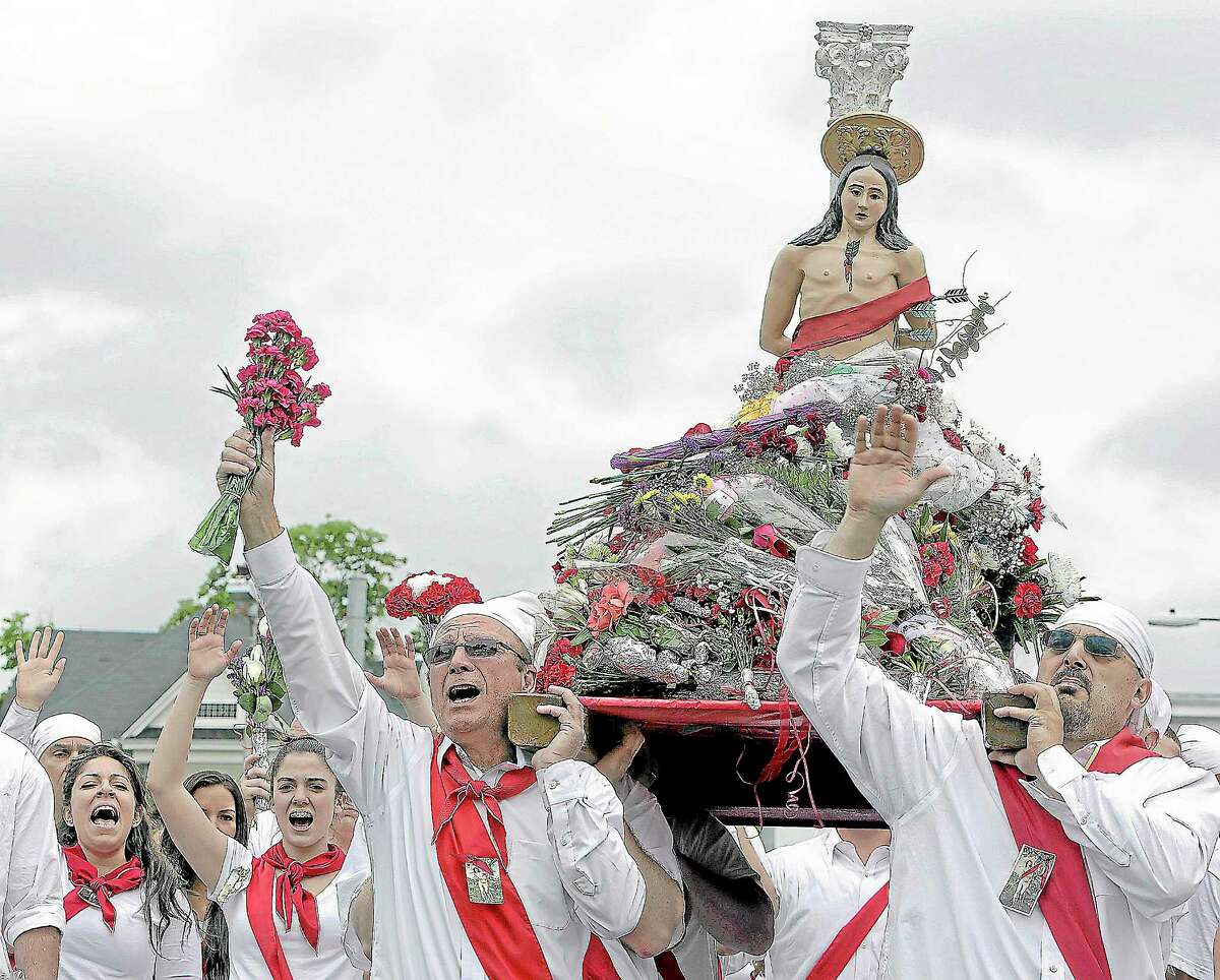 The statue of St. Sebastian is carried through the streets of Middletown by “I Nuri” during the annual Feast of St. Sebastian.