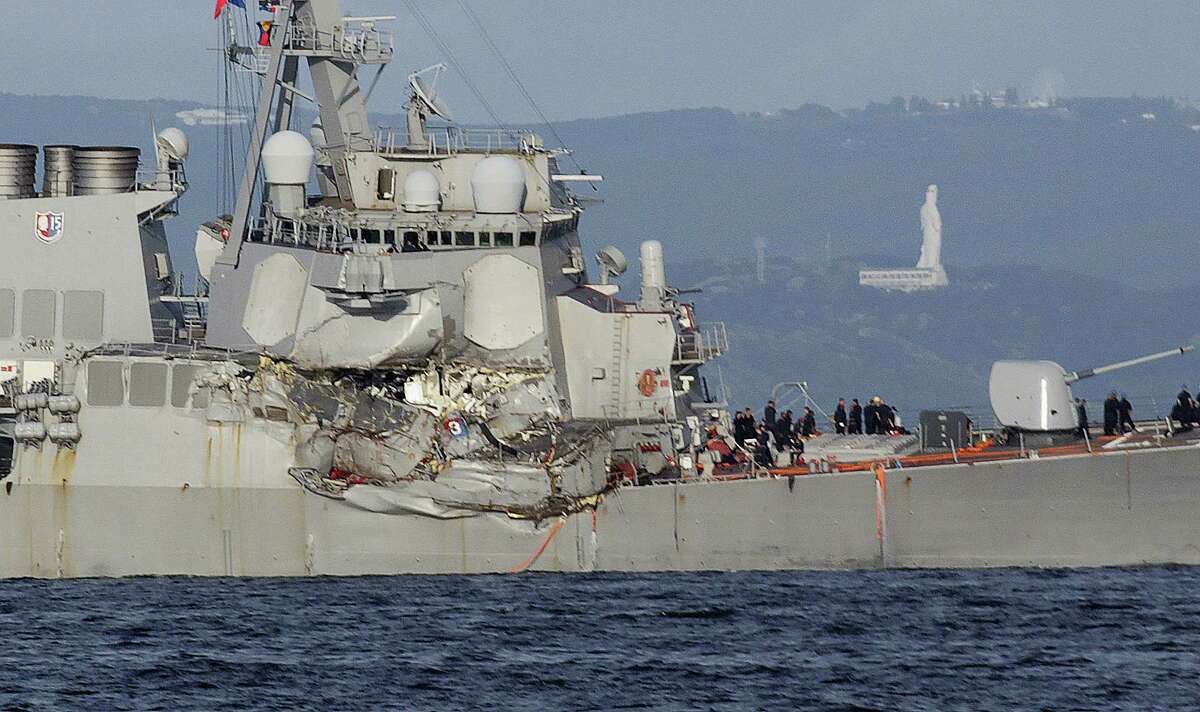 The damaged USS Fitzgerald is seen near the U.S. Naval base in Yokosuka, southwest of Tokyo, after the U.S. destroyer collided with the Philippine-registered container ship ACX Crystal in the waters off the Izu Peninsula Saturday, June 17, 2017. The USS Fitzgerald was back at its home port in Japan after colliding before dawn Saturday with the container ship four times its size, while the coast guard and Japanese and U.S. military searched for seven sailors missing after the crash.