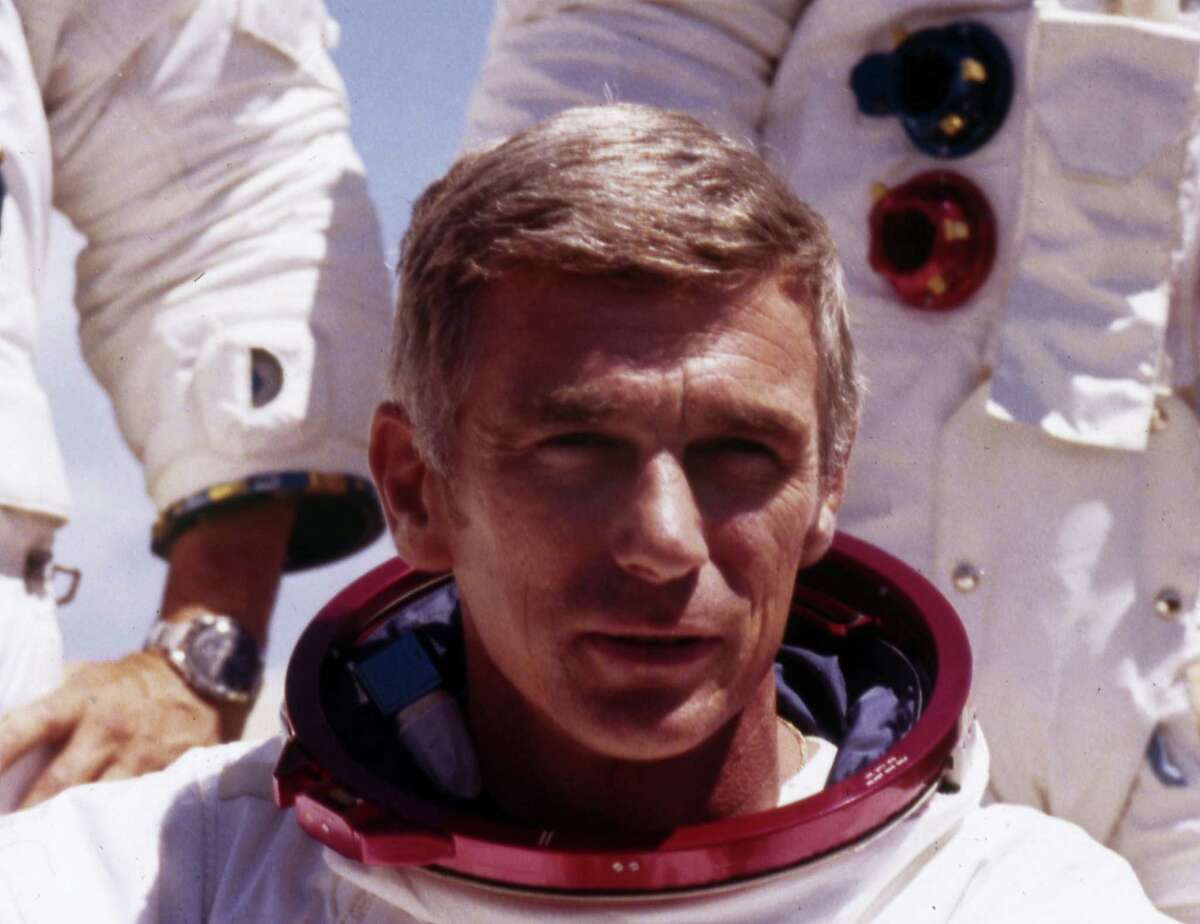 FILE - In an undated file photo provided by NASA, US Navy Commander and Astronaut for the upcoming Apollo 17, Eugene Cernan, is pictured in his space suit. NASA announced that former astronaut Cernan, the last man to walk on the moon, died Monday, Jan. 16, 2017, surrounded by his family. He was 82.