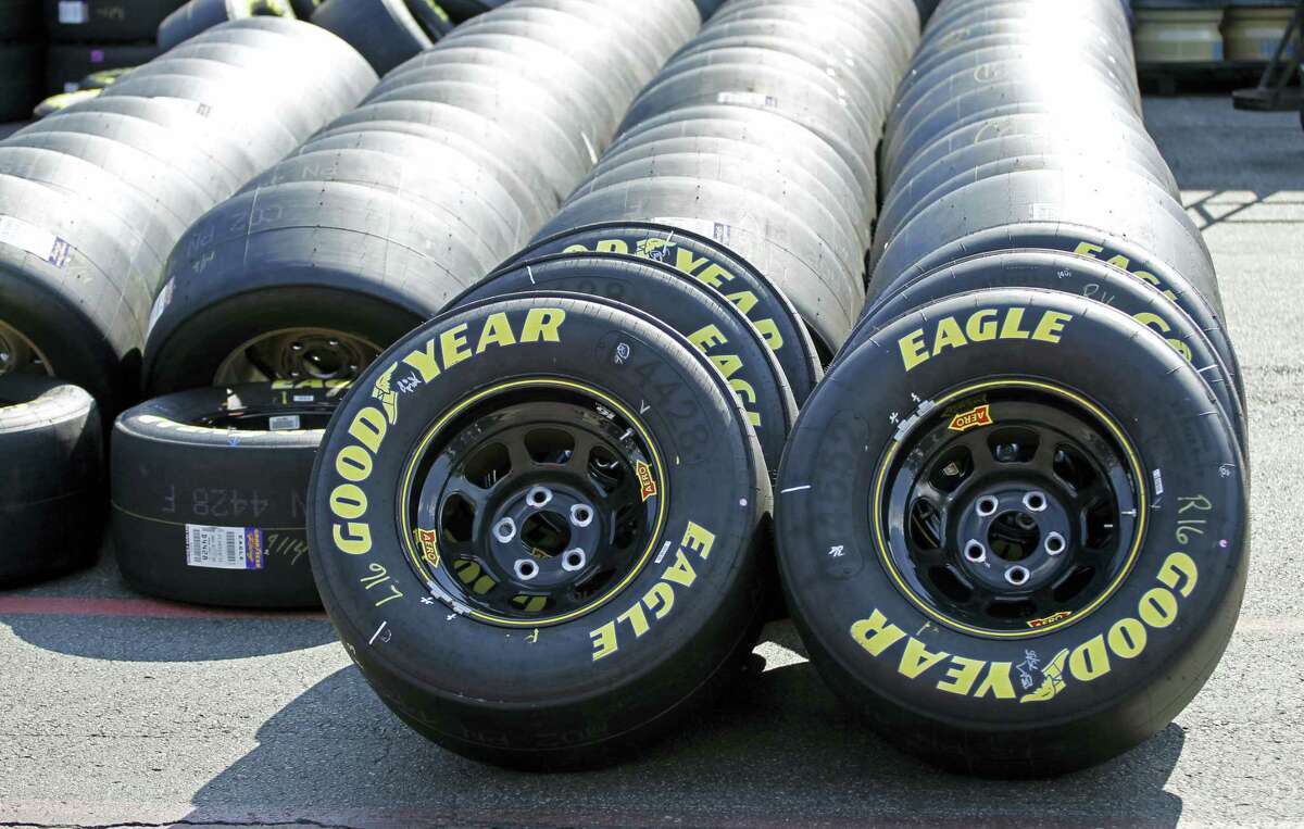 Goodyear racing tires are lined up in the garage during practice for a NASCAR Sprint Cup series race.