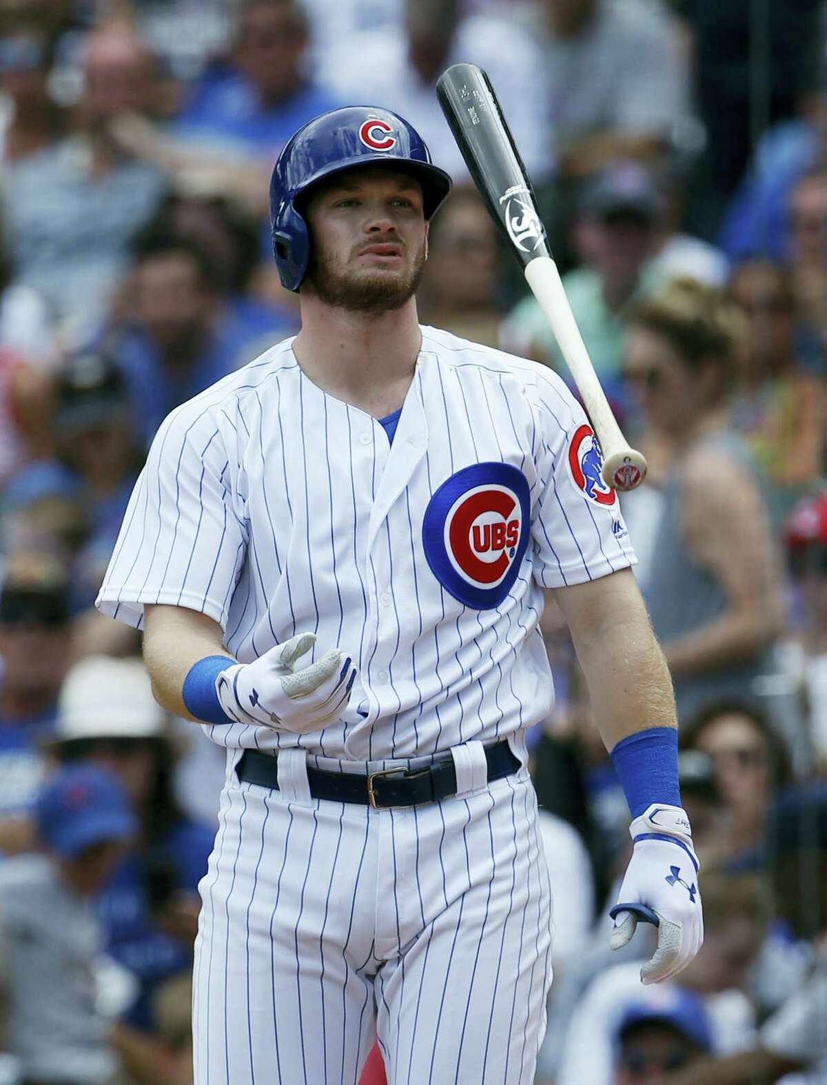 Chicago Cubs’ Ian Haps reacts as tosses his bat after being called out on strikes during the first inning of a baseball game against the Pittsburgh Pirates July 9, 2017, in Chicago.