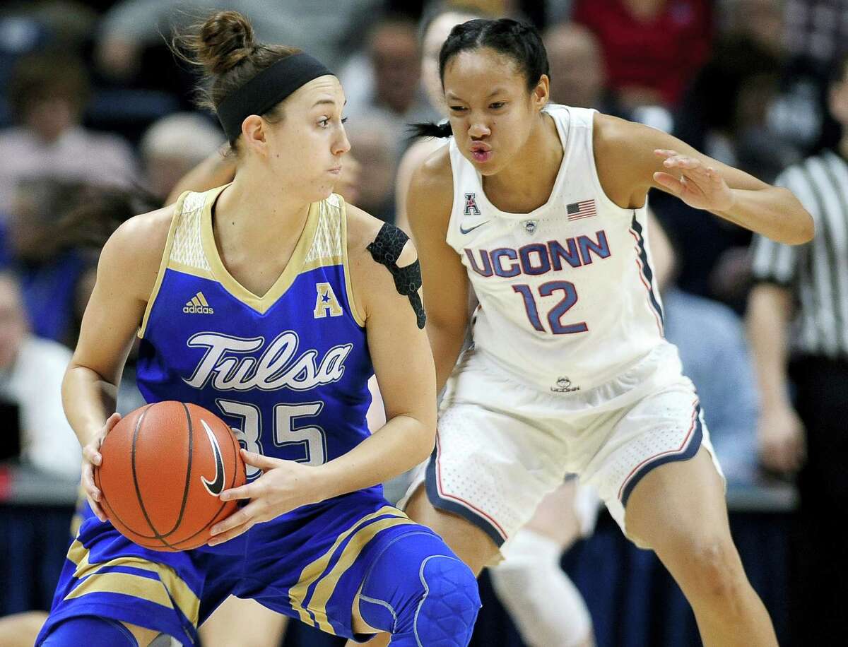 UConn’s Saniya Chong, right, guards Tulsa’s Liesl Spoerl during Sunday’s game in Storrs.