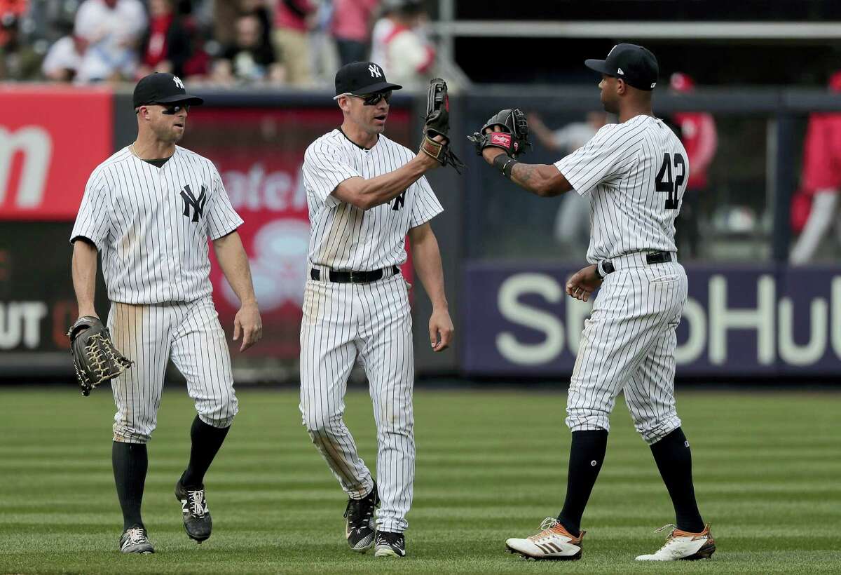 From left, the Yankees’ Brett Gardner, Jacoby Ellsbury and Aaron Hicks celebrate after Saturday’s win.