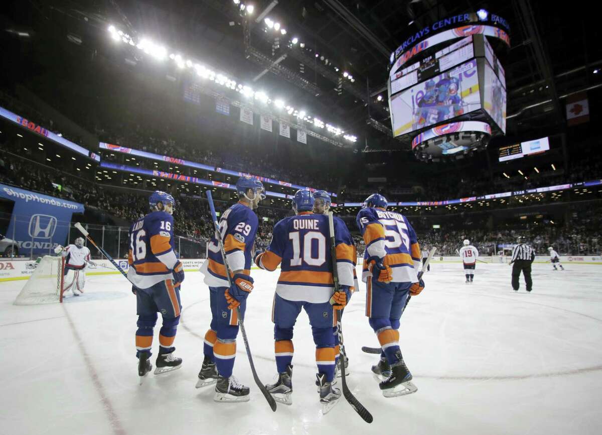 Members of the New York Islanders huddle up during a recent game.