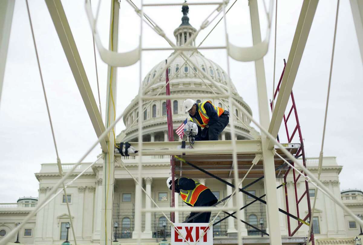 Construction continues on the Inaugural platform in preparation for the Inauguration and swearing-in ceremonies for President-elect Donald Trump, on the Capitol steps in Washington. Trump’s Presidential Inaugural Committee has raised a record $90 million-plus in private donations, far more than President Barack Obama’s two inaugural committees. They collected $55 million in 2009 and $43 million in 2013, and had some left over on the first go-round. But while Trump has raised more money for his inauguration than any president in history, he’s aiming to do less with it.