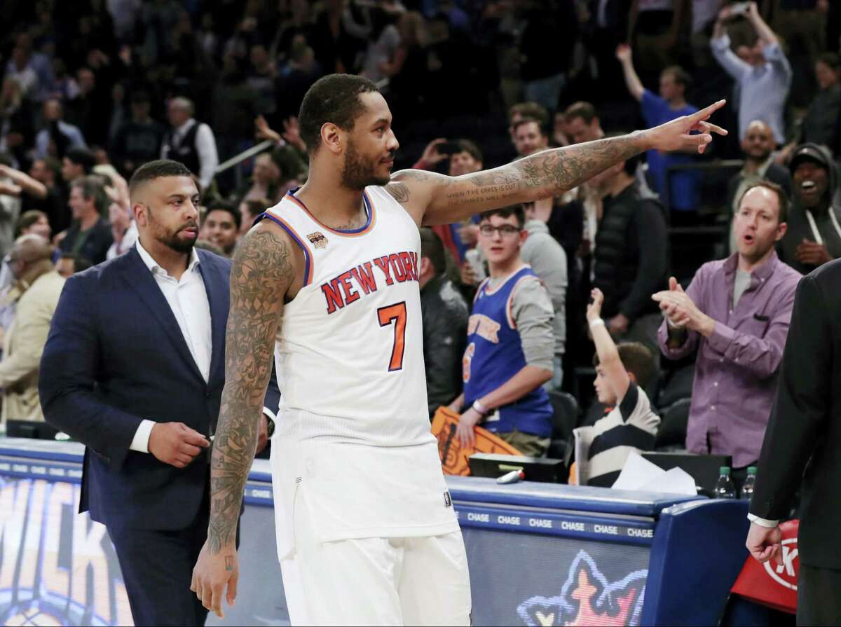 The Knicks’ Carmelo Anthony gestures to fans after a game this season.