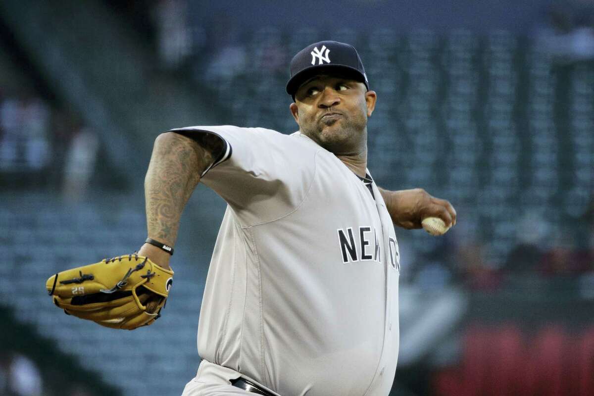 New York Yankees starting pitcher CC Sabathia throws against the Los Angeles Angels during the first inning of a baseball game, Tuesday in Anaheim