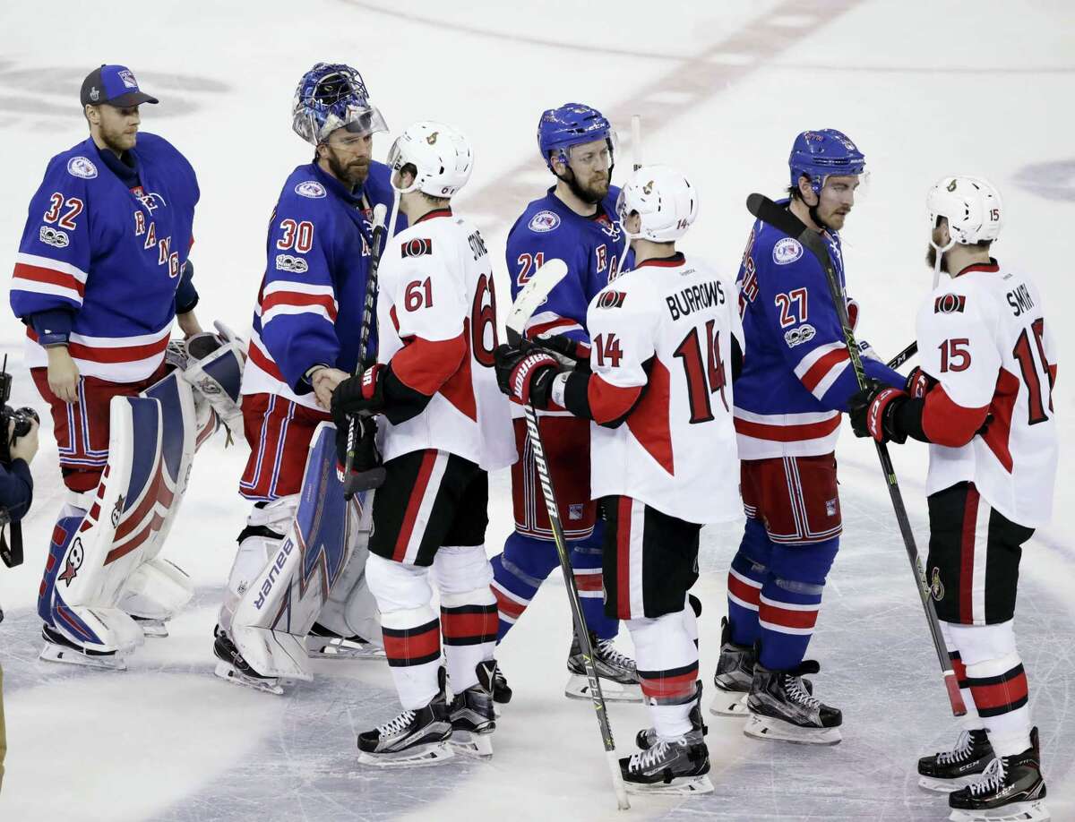 Members of the Rangers shake hands with members of the Senators after Game 6 of their playoff season..