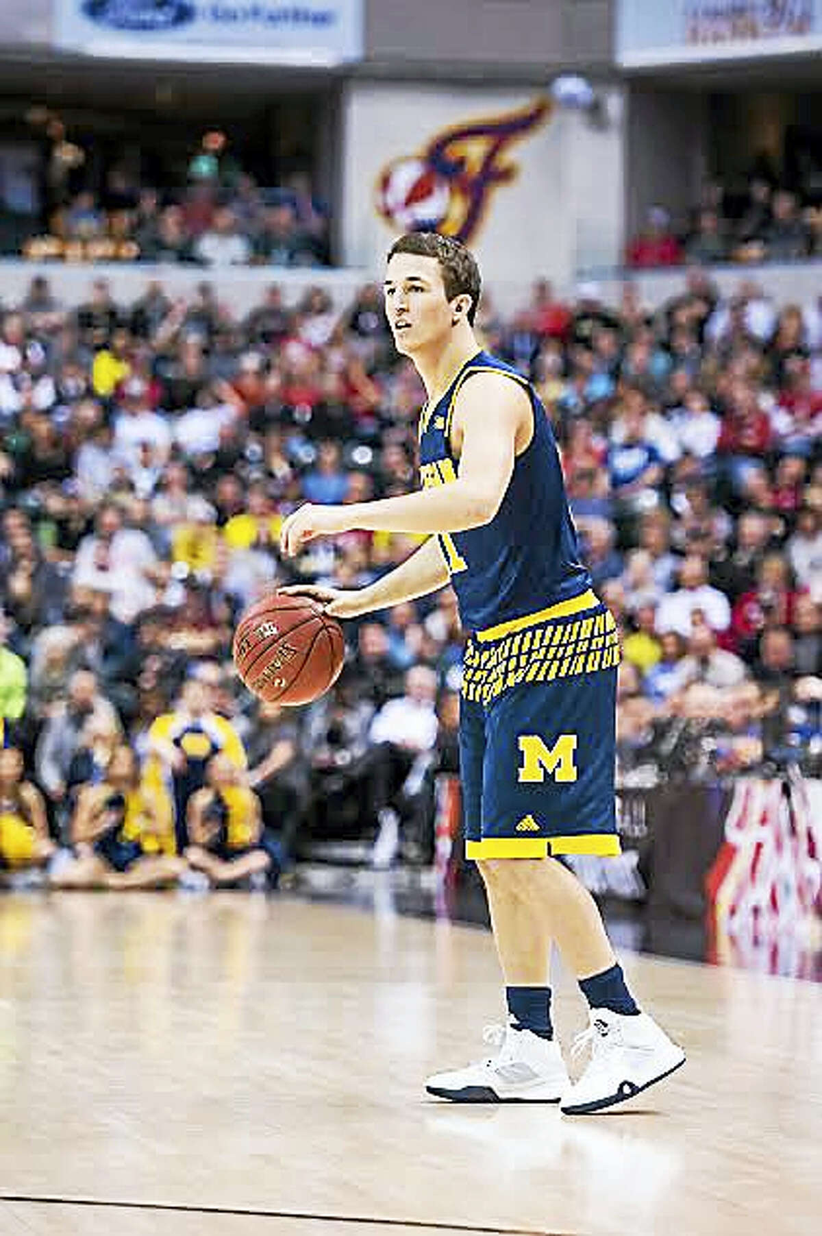 Andrew Dakich, a back-up point guard at Michigan for three years, transferred to Quinnipiac last week.
