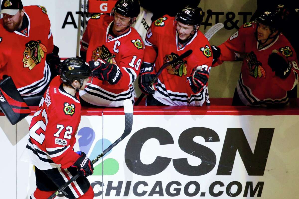 Chicago Blackhawks left wing Artemi Panarin (72) celebrates with teammates after scoring a goal during the first period of an NHL hockey game against the Nashville Predators on Jan. 8, 2017 in Chicago.