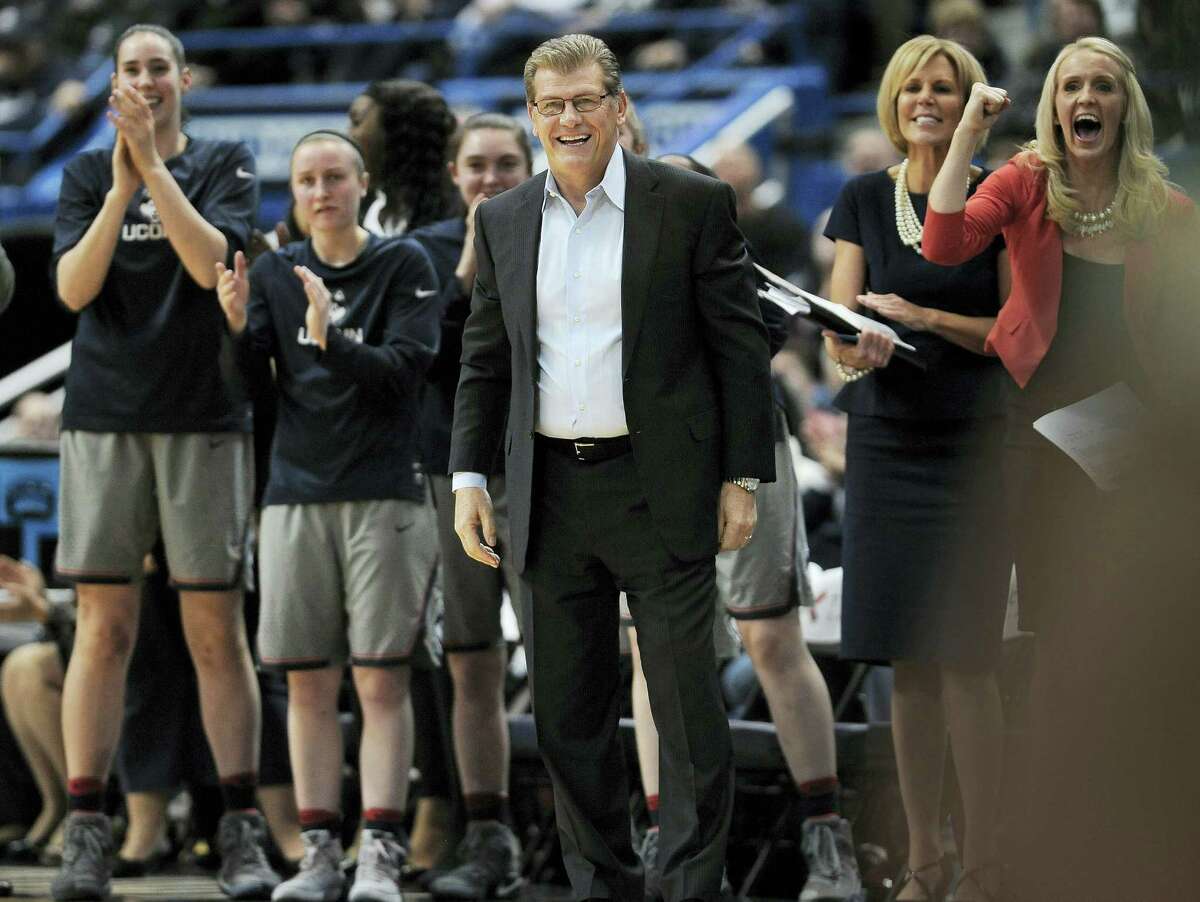Connecticut head coach Geno Auriemma, center, and his team reacts in the first half of an NCAA college basketball game against South Florida on Jan. 10, 2017 in Hartford.