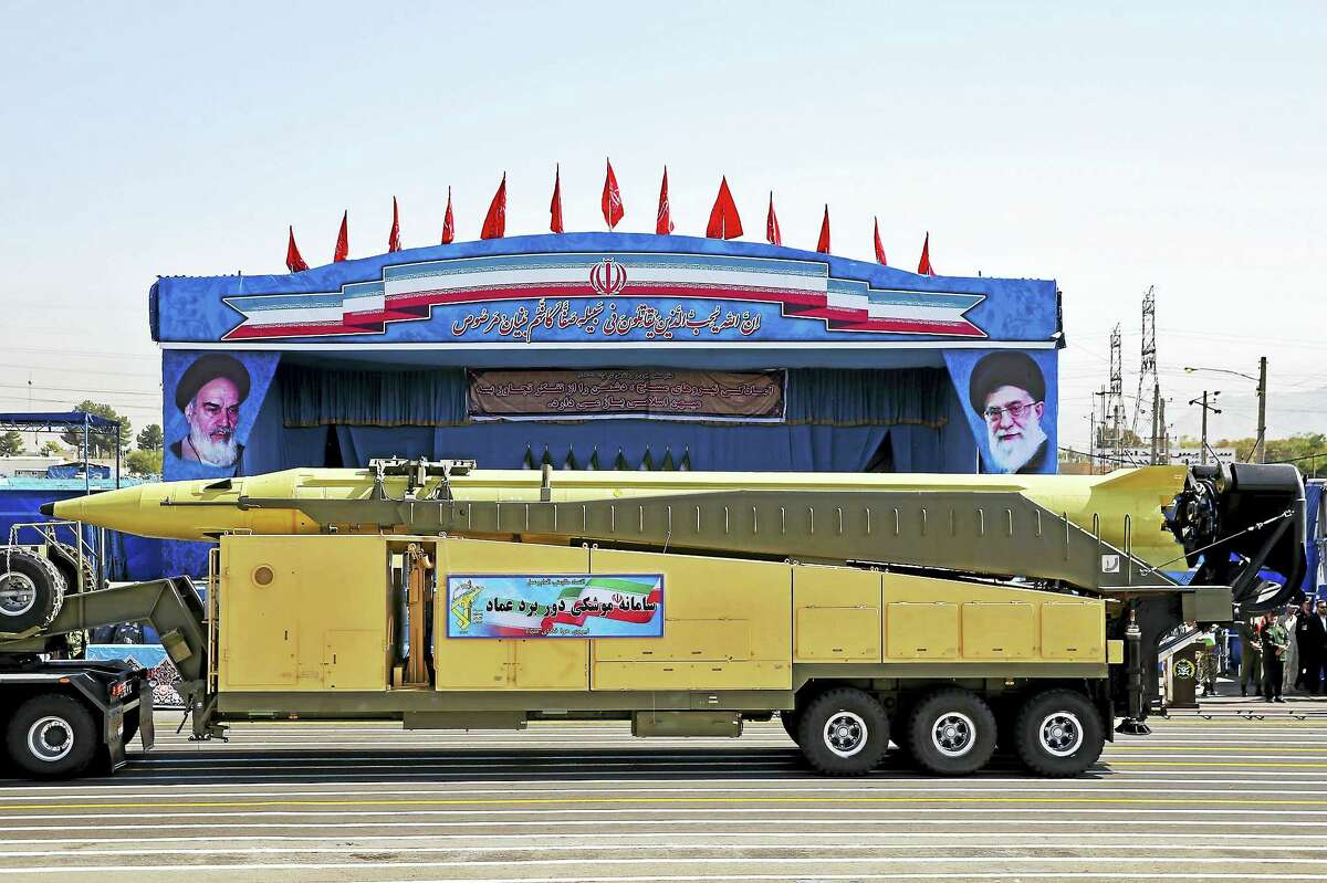 An Emad long-range ballistic surface-to-surface missile is displayed by the Revolutionary Guard during a military parade, in front of the shrine of late revolutionary founder Ayatollah Khomeini, just outside Tehran, Iran. At a joint news conference Tuesday, Jan. 31, 2017, with his visiting French counterpart Jean-Marc Ayrault, Iranian Foreign Minister Mohammad Javad Zarif, refused to confirm that the country conducted a recent missile test, saying Iran’s missile program is not part of a 2015 landmark nuclear deal between his country and world powers.