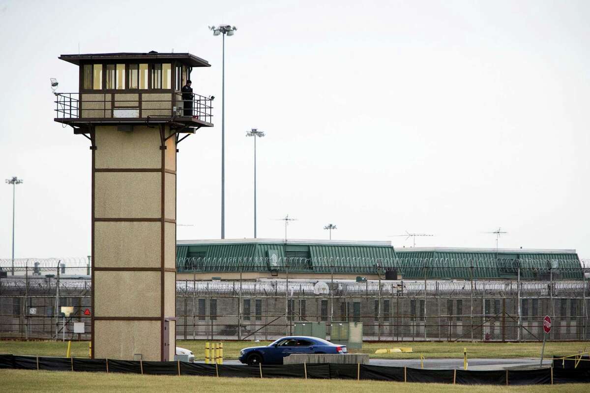 A prison guard stands at one of the towers at James T. Vaughn Correctional Center. All Delaware prisons went on lockdown on Wednesday due to a hostage situation unfolding at the James T. Vaughn Correctional Center in Smyrna, Del.