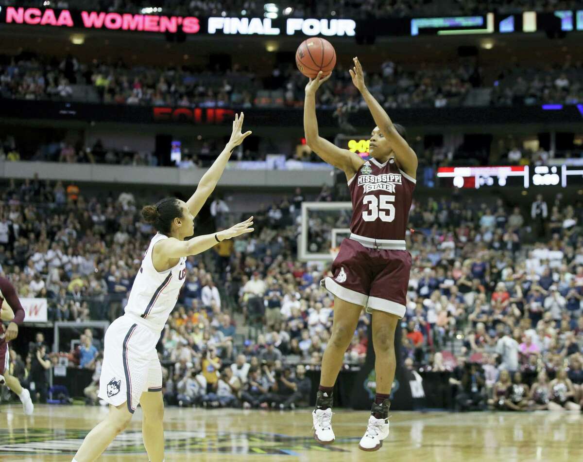 Mississippi State forward Victoria Vivians shoots over Connecticut guard Saniya Chong during the first half of the semifinals of the women’s Final Four. Chong is excpected to be selected in Thursday’s WNBA Draft,