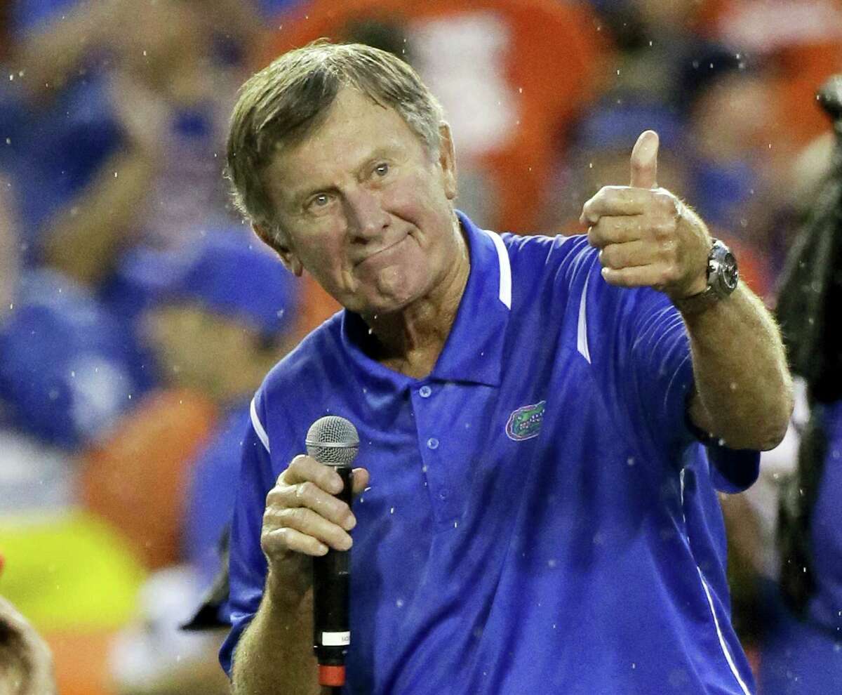 In this Sept. 3, 2016 photo, former Florida player and head coach Steve Spurrier makes remarks after he was honored during an NCAA college football game against Massachusetts in Gainesville, Fla. Peyton Manning and his Southeastern Conference nemesis, former Florida coach Spurrier, will go into the College Football Hall of Fame together. Spurrier built Florida into an SEC powerhouse from 1990-2001, winning six conference titles and the school’s first national championship in 1996.