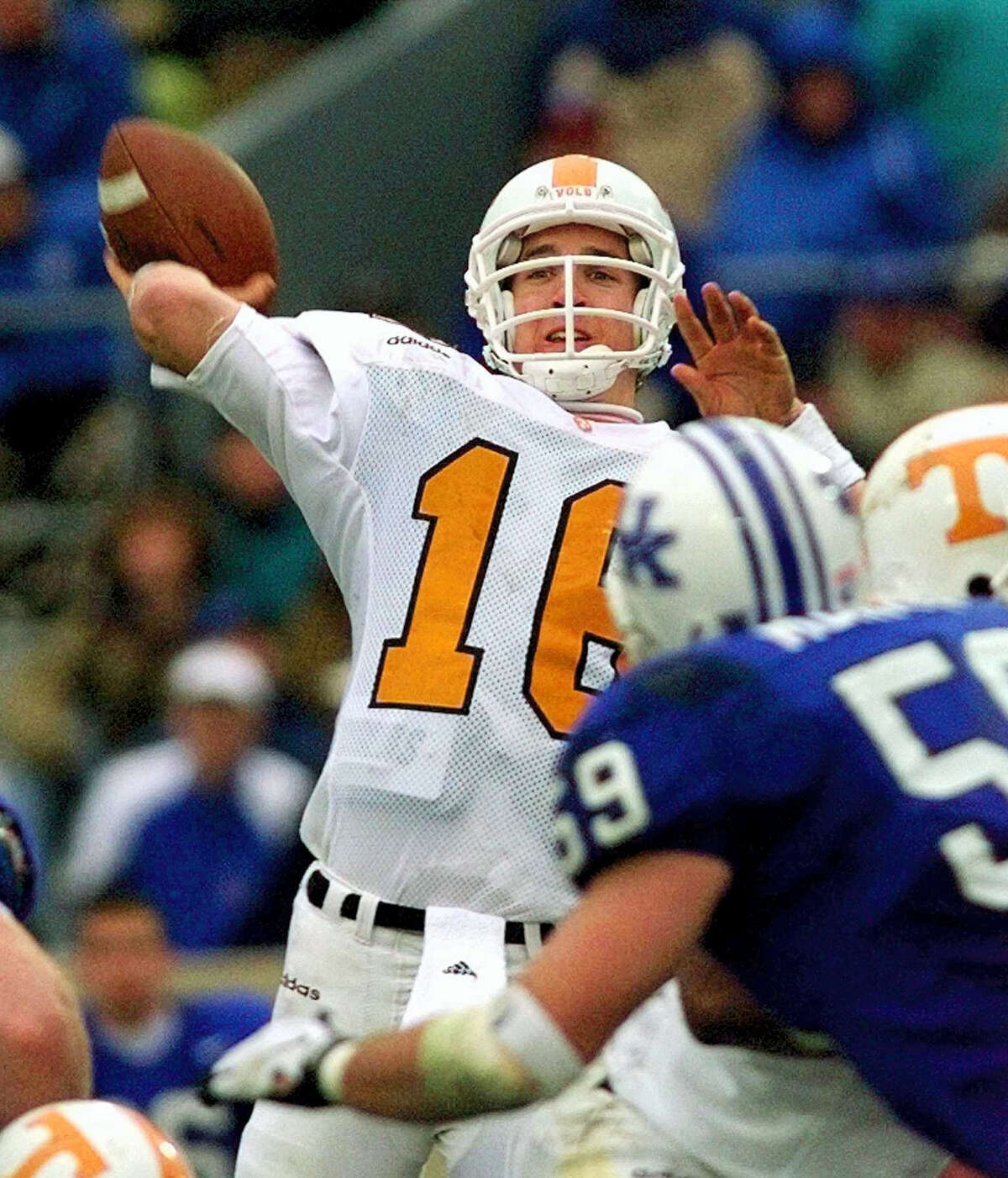 Tennessee quarterback Peyton Manning launches a pass. Manning and his Southeastern Conference nemesis, former Florida coach Steve Spurrier, will go into the College Football Hall of Fame together.