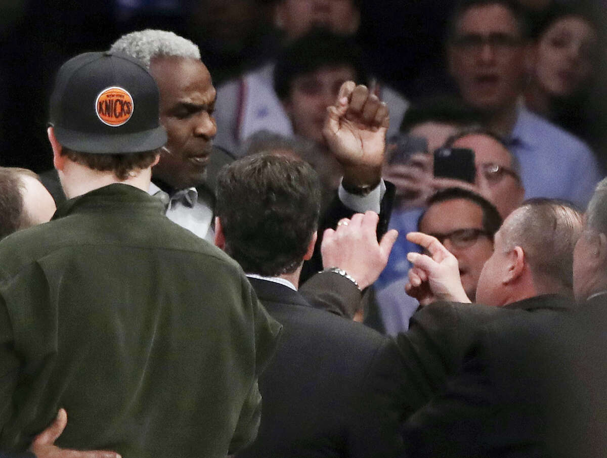 Former New York Knicks player Charles Oakley exchanges words with a security guard during the first half of an NBA basketball game between the New York Knicks and the LA Clippers on Feb. 8, 2017 in New York.