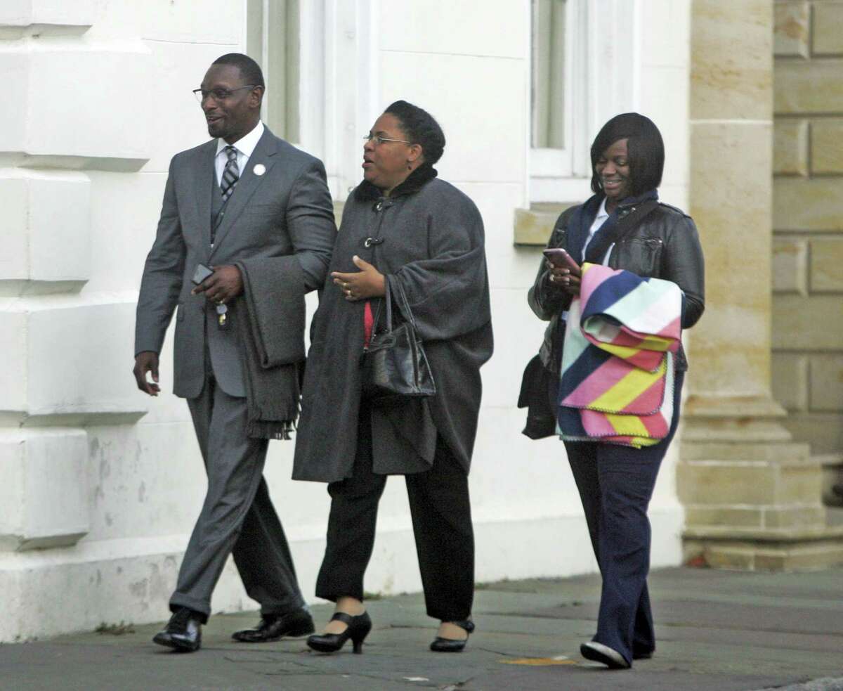 The Rev. Kylon Middleton, from left, Jennifer Pinckney, widow of Emanuel’s slain pastor, the Rev. Clementa Pinckney and Johnette Martinez enter the courthouse in Charleston, S.C., Wednesday, Jan. 4, 2017, for the sentencing phase of Dylann Roof’s trial. The jury last month unanimously found Roof guilty of hate crimes and other charges in the shooting deaths of nine black church members during Bible study. The jurors will now decide whether he should be sentenced to life in prison or death.
