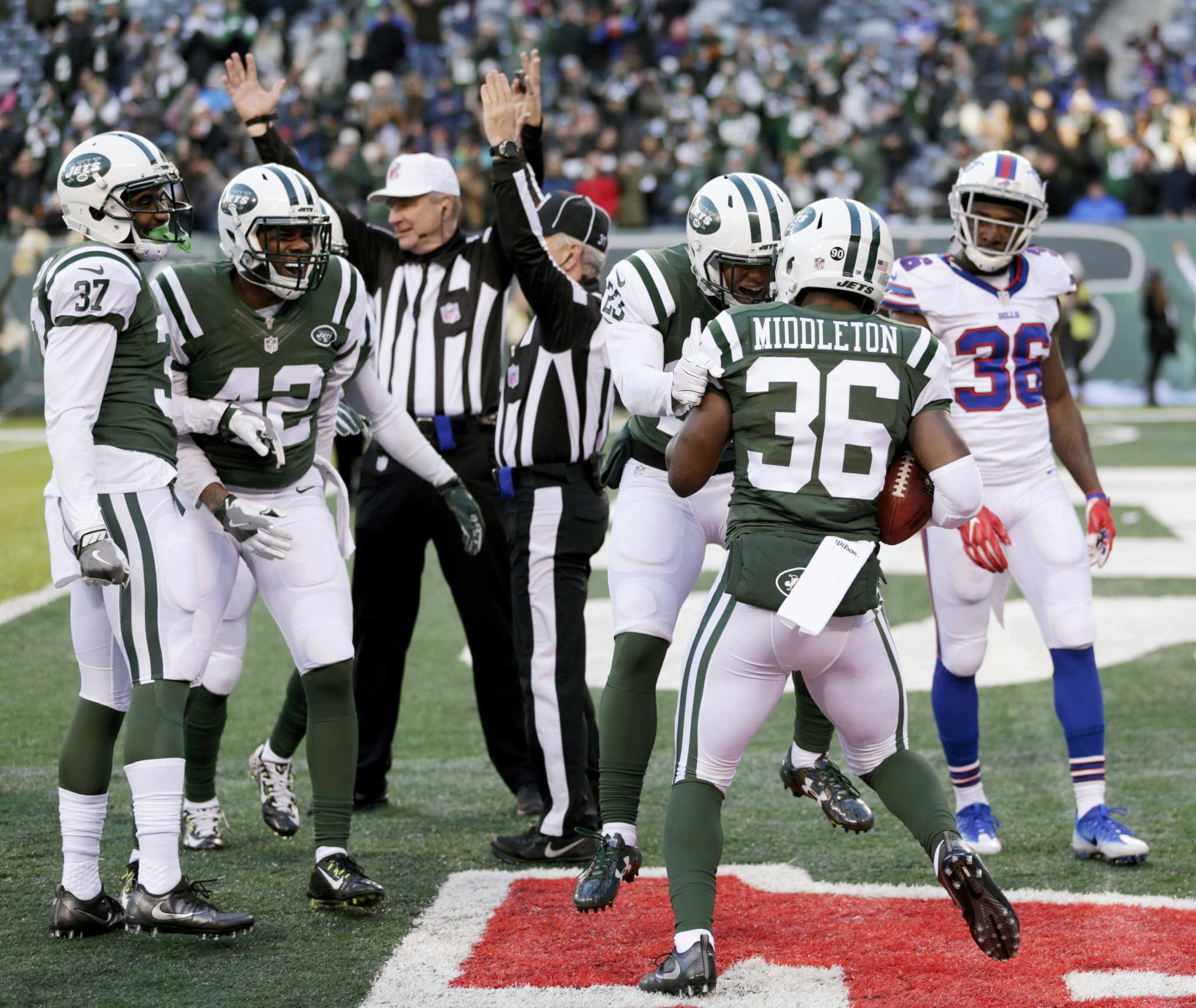 New York Jets head coach Todd Bowles and coaching staff stand on the  sidelines in the 4th quarter against the New England Patriots at MetLife  Stadium in East Rutherford, New Jersey on