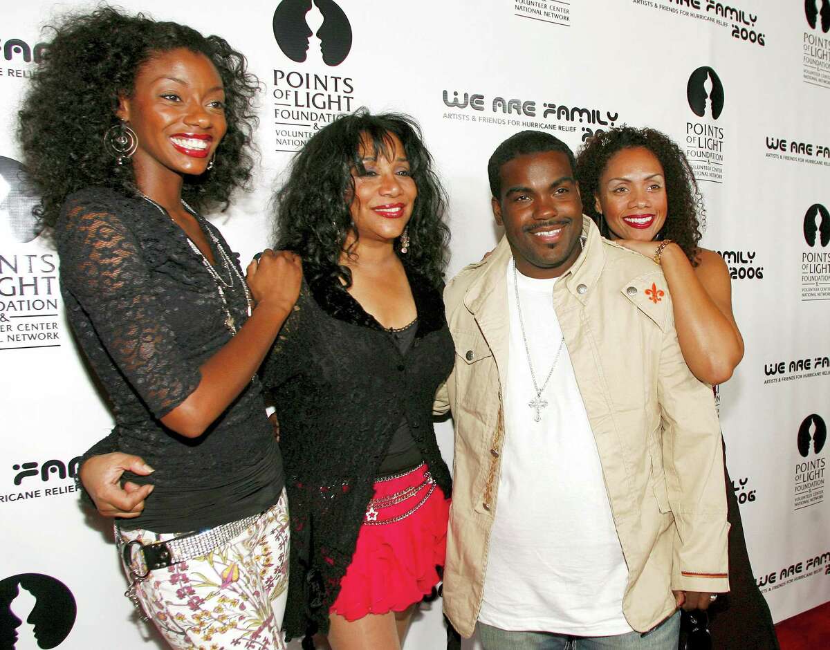 This Aug. 14, 2006 photo shows Joni Sledge, one of the original members of “Sister Sledge,” second from left, posing with Rodney Jerkins, second from right, her niece Camille Sledge, left, and her cousin Amber Sledge at the “We Are Family 2006 — All-Star Katrina Benefit CD and Documentary DVD Launch” in Century City, Calif. Sledge, who with her sisters recorded the defining dance anthem “We Are Family,” has died, the band’s representative says. She was 60.