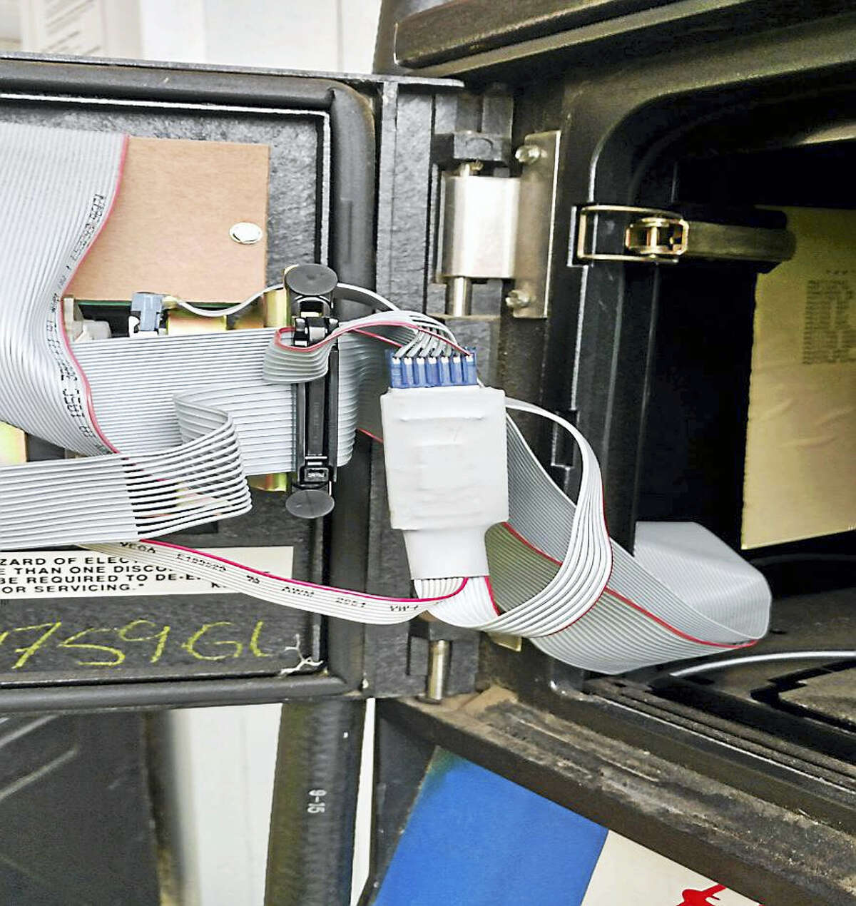 The inside of the gas pump payment system where the card skimming device was found on Tuesday in Essex