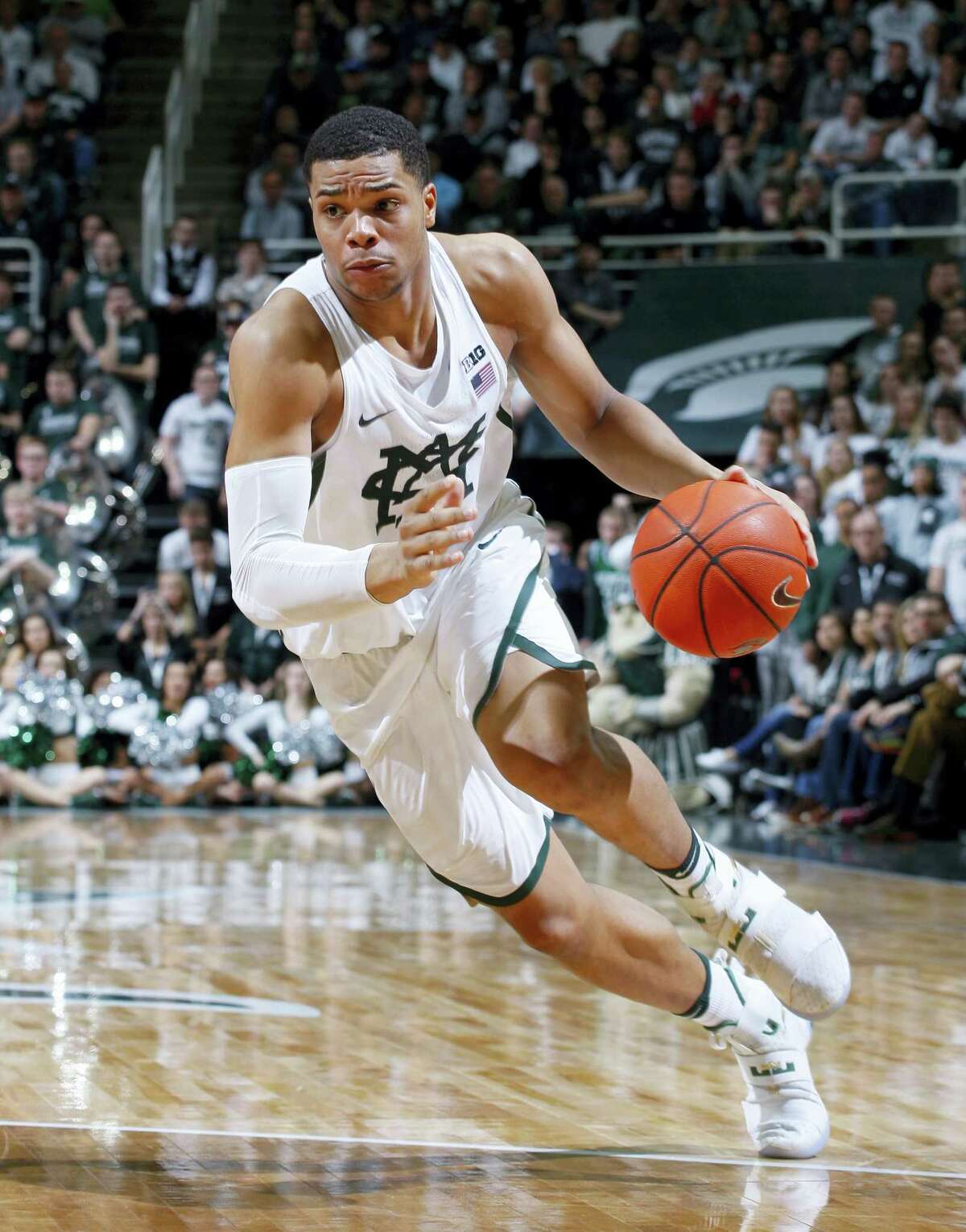In this Feb. 26, 2017 photo, Michigan State’s Miles Bridges drives during the second half of an NCAA college basketball game against Wisconsin, in East Lansing, Mich. Bridges was selected as newcomer of the year for the Big Ten Conference on March 7, 2017.