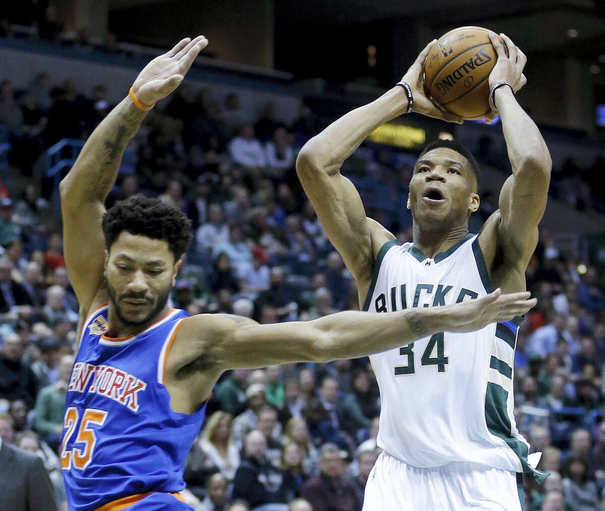 Milwaukee Bucks’ Giannis Antetokounmpo (34) drives past New York Knicks’ Derrick Rose (25) during the second half of an NBA basketball game March 8, 2017 in Milwaukee.