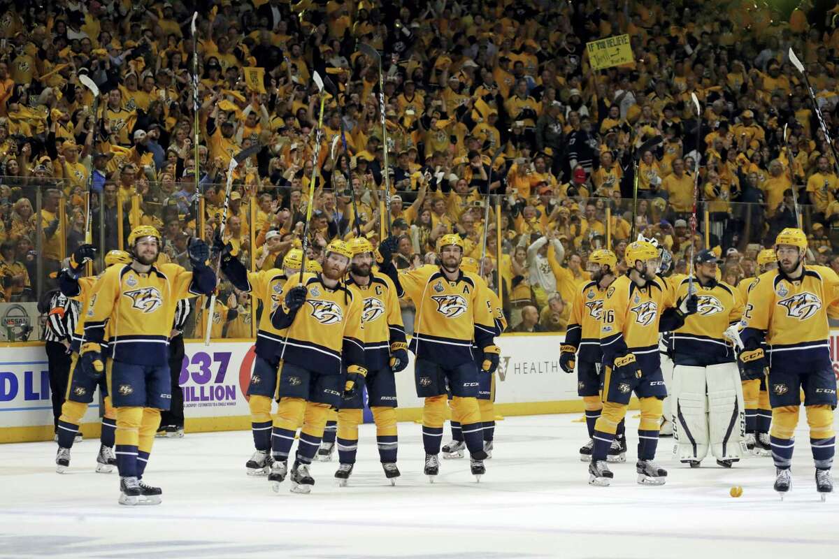 Nashville Predators players salute fans after Game 3 of the NHL hockey Stanley Cup Finals against the Pittsburgh Penguins Saturday, June 3, 2017, in Nashville, Tenn. The Predators won 5-1. (AP Photo/Mark Humphrey)