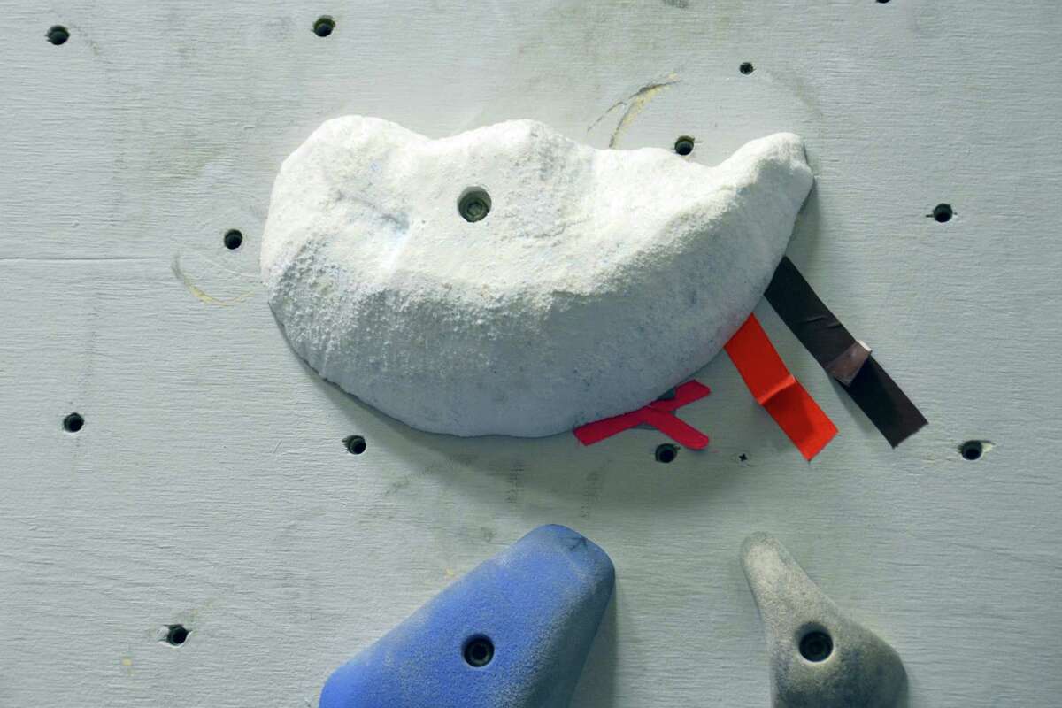 This Jan. 16, 2016 photo provided by Dartmouth College shows fabricated holds mounted on a climbing wall in Hanover, N.H. The hold, created by using three-dimensional geometry, is part of a replica of a rock wall created by tracking a climber’s hand and foot positions and by estimating the contact forces.