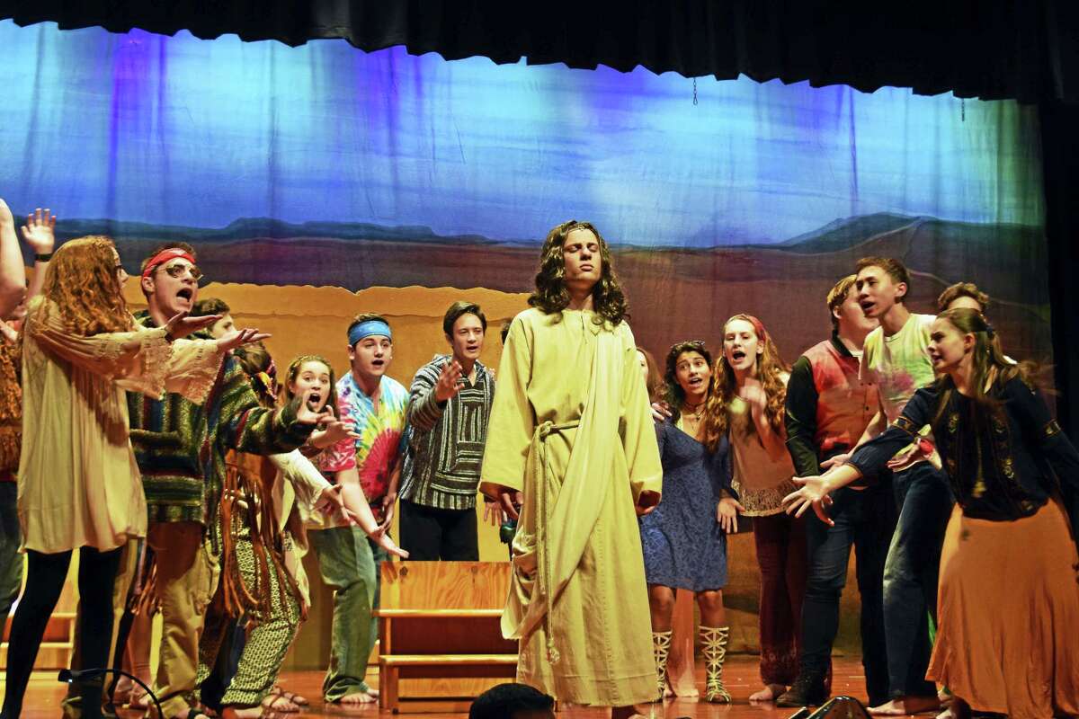 Jesus, played by Nathaniel Goff, and the ensemble in “What’s the Buzz” in a scene from “Jesus Christ Superstar” presented by the Mercy Xavier Drama Club this weekend.