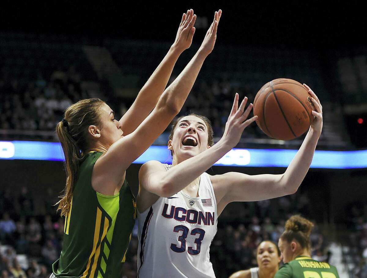 UConn’s Katie Lou Samuelson shoots over South Florida’s Ariadna Pujol during the first half .