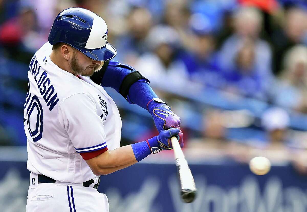 Toronto’s Josh Donaldson hits a solo home run against the New York Yankees during the first inning Friday. Donaldson hit two homers as the Blue Jays beat the Yankees 7-5.