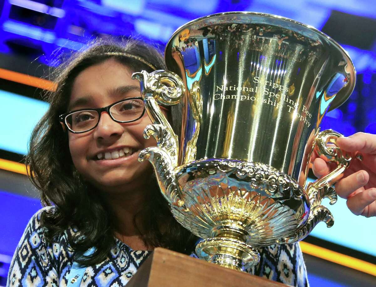 Ananya Vinay, 12, from Fresno, Calif., holds the trophy after being declared the winner of the 90th Scripps National Spelling Bee, in Oxon Hill, Md., Thursday, June 1, 2017.