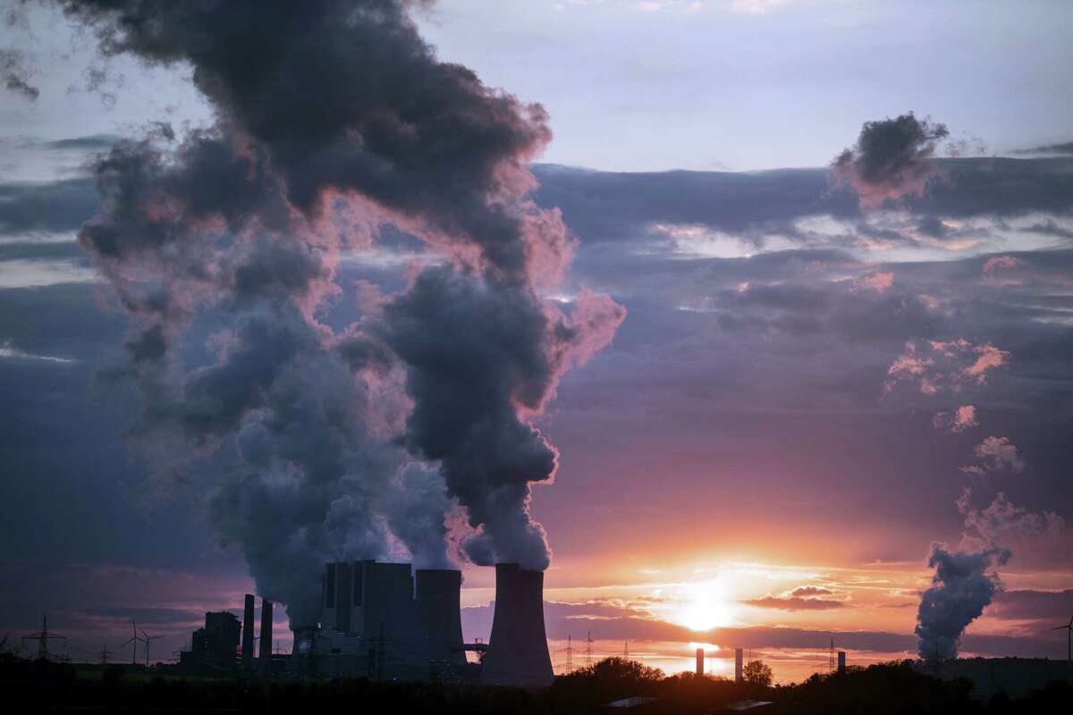 In this April 27, 2017, file photo smoke billows out of the chimneys of the Neurath lignite power plant in Neurath. Germany. World leaders affirmed their commitment Thursday, June 1, 2017, to combating climate change ahead of U.S. President Donald Trump’s announcement on whether he would pull out of the Paris climate accord. Trump is expected to announce his decision on Thursday afternoon.