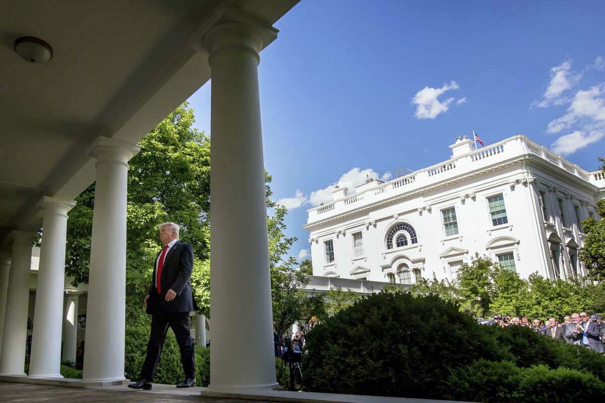 President Donald Trump walks to the Oval Office of the White House in Washington, Thursday, after speaking in the Rose Garden about the US role in the Paris climate change accord. AP Photo — Andrew Harnik