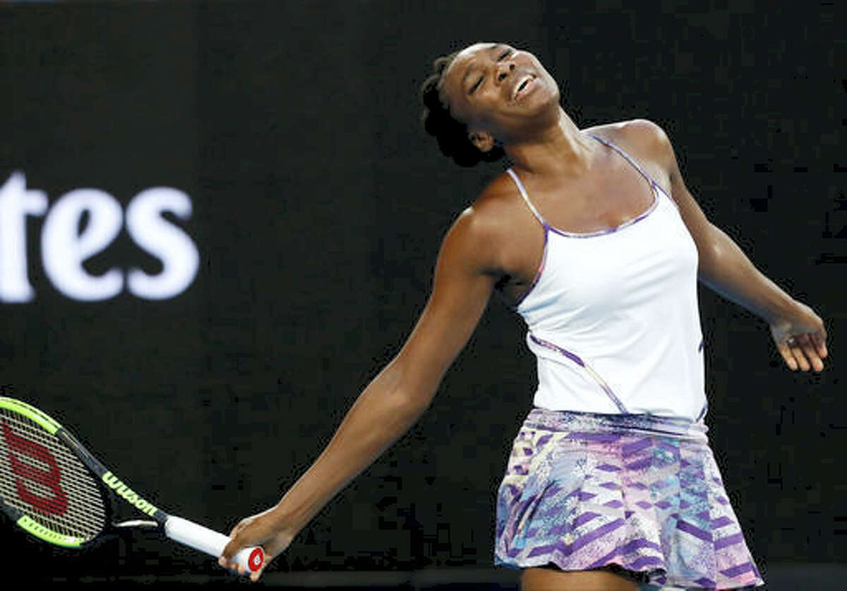 In this Jan. 28, 2017 photo, United States’ Venus Williams reacts after missing a shot against sister Serena during the women’s singles final at the Australian Open tennis championships in Melbourne, Australia. Williams will show off her spring tennis clothing line at Madison Square Garden. The EleVen by Venus collection will be worn by ball girls and ushers at the BNP Paribas Showdown on Monday, March 6. Williams will also play French Open champion Garbine Muguruza in the exhibition.