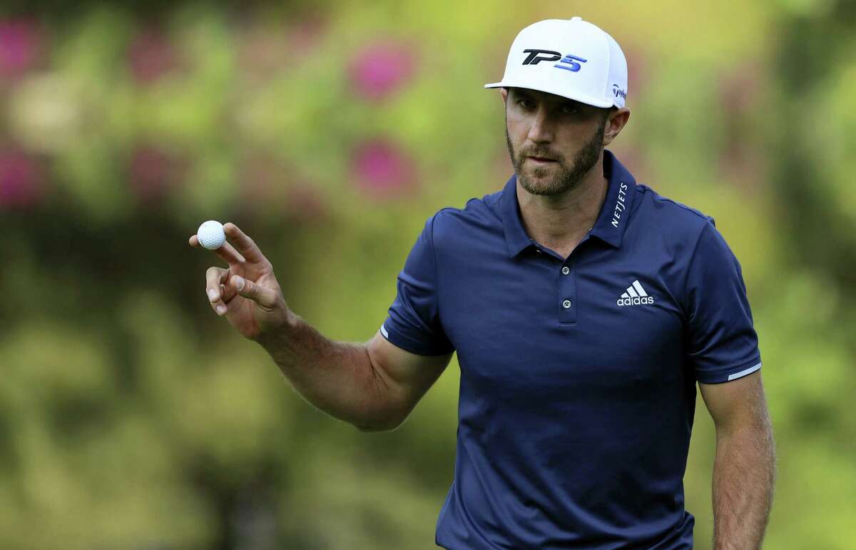 Dustin Johnson shows the ball after hitting at the 17th green during the final round of the Mexico Championship on Sunday.