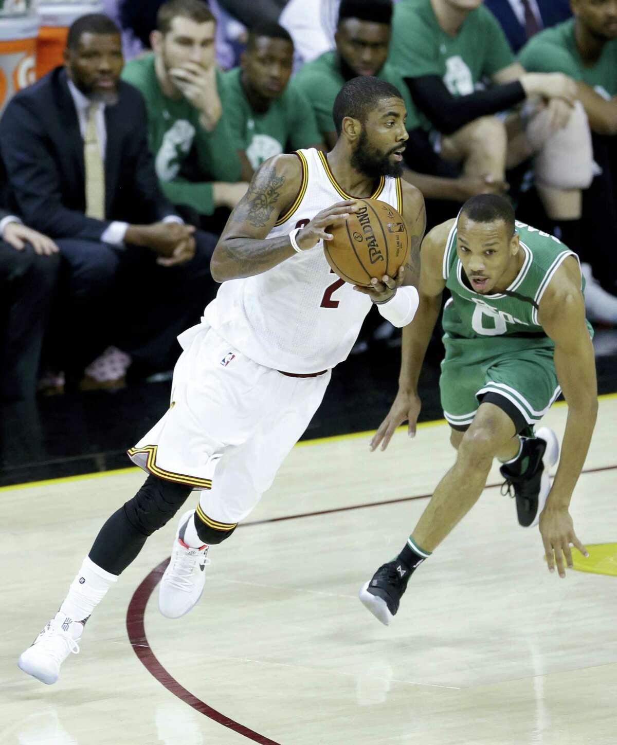Cleveland Cavaliers’ Kyrie Irving (2) drives against Boston Celtics’ Avery Bradley (0) during the first half of Game 4 of the NBA basketball Eastern Conference finals on May 23, 2017 in Cleveland.