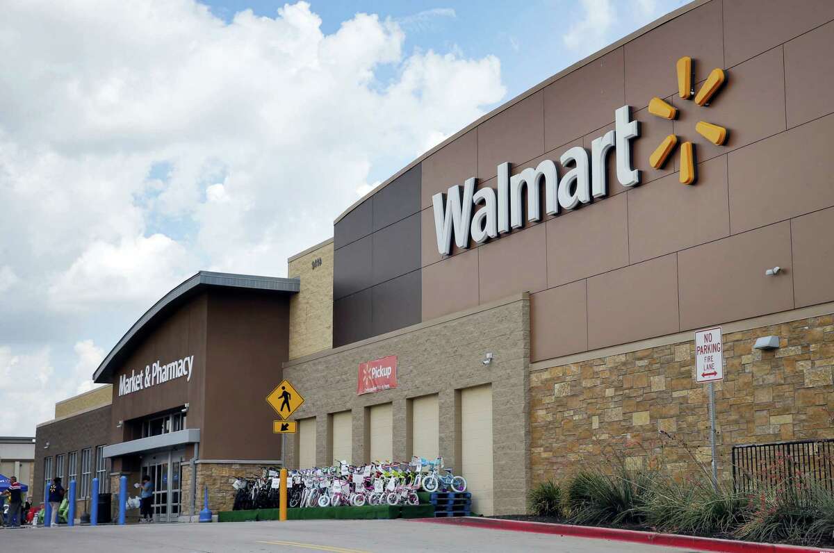 People walk in and out of a Walmart store in Dallas.
