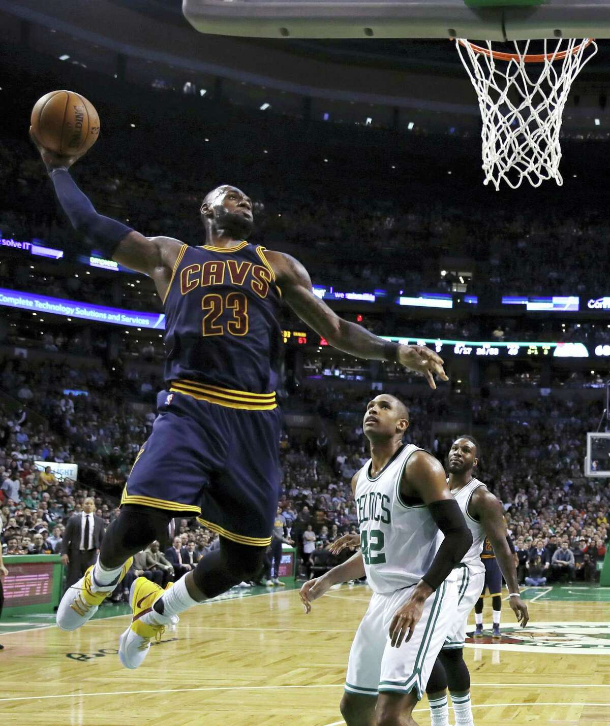 Cleveland Cavaliers forward LeBron James (23) lines up a dunk against Boston Celtics center Al Horford (42) during the third quarter of an NBA basketball game in Boston on March 1, 2017.