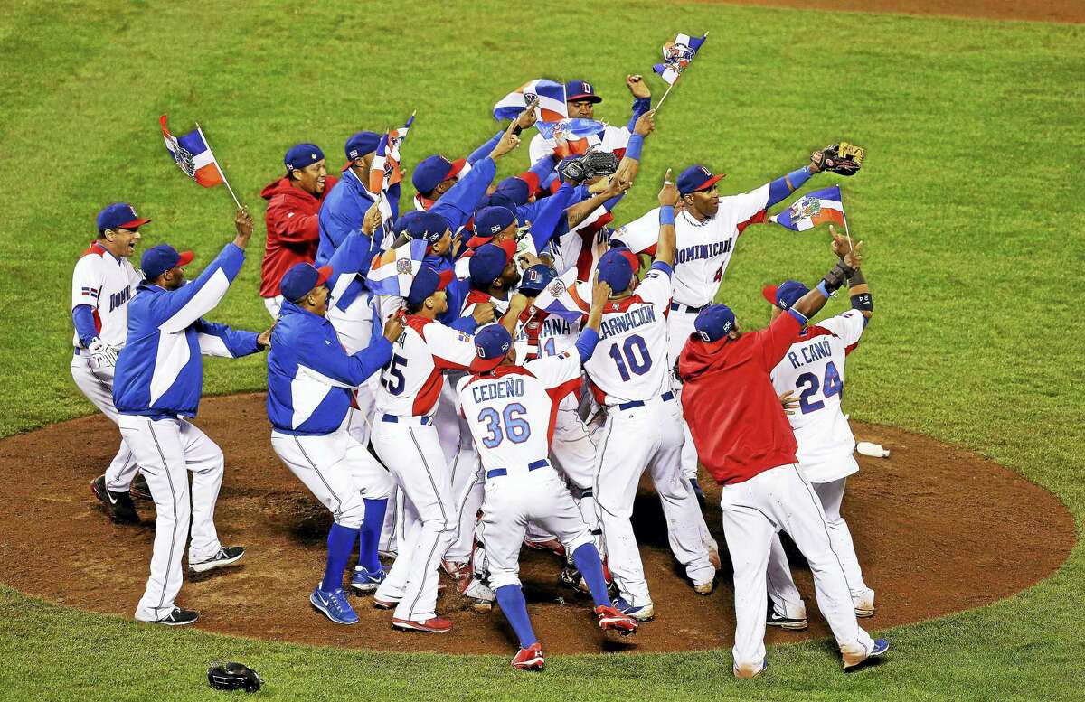 Players from the Dominican Republic celebrate after beating Puerto Rico in the championship game of the 2013 World Baseball Classic.